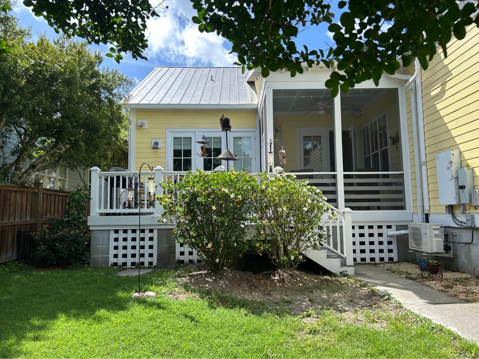 Screened back porch and tin roof from the yard